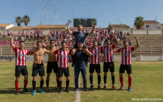 Football team celebrating a victory, players and coach in a Spanish lower-league stadium, fans cheering in the background,...